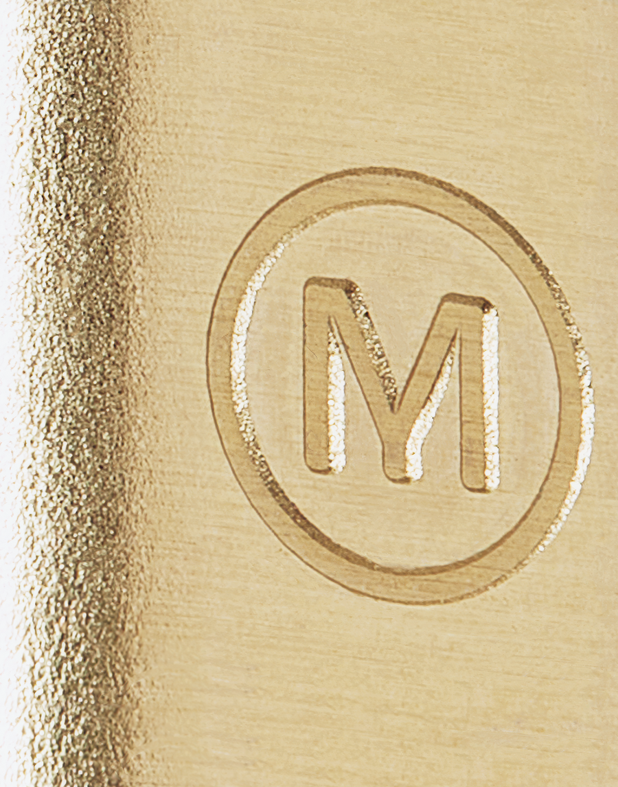 Close up detail of the MANTLE custom branded connection clamp in solid brass