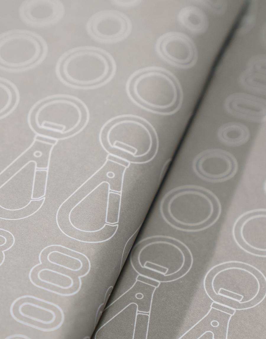 MANTLE branded packing tissue paper white ink on gray paper